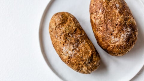 Two air fryer potatoes on a plate