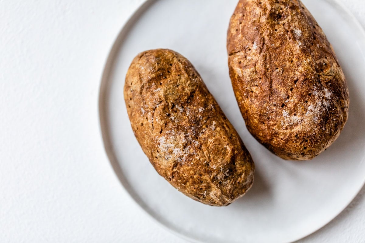 Two air fryer potatoes on a plate